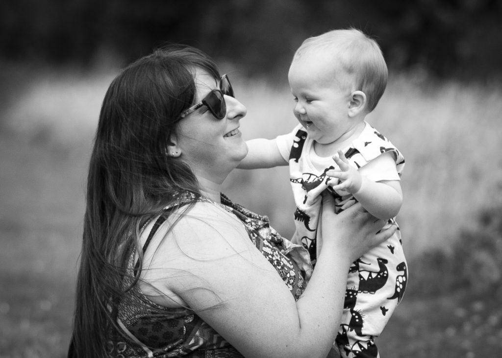 Portrait-Mother-Daughter-Park-Holding-Smiling-Black-and-White-Sunny-Laughing-Grass